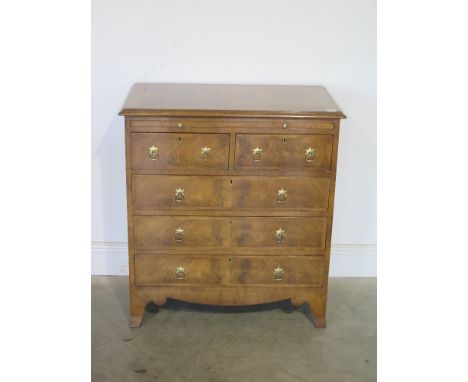 A walnut re veneered chest with a brushing slide above five drawers on bracket feet - Width 76cm  x Height 83cm 