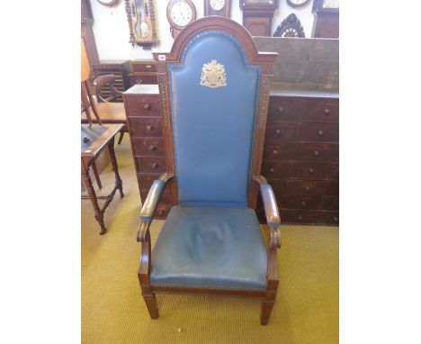 An early 20th century walnut throne chair with blue leather upholstery with gilt crest and motto - In Concilio Consilivm - He