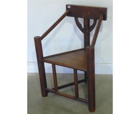An oak Warwick chair with carved back - initialled Q M P