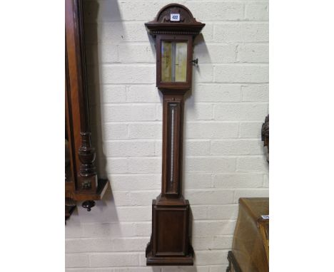 A Victorian walnut stick barometer with thermometer - Height 1.03 m 
Condition report:  Needs some restoration to mercury lev