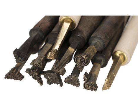 * Decorative finishing tools. 17 brass decorative finishing tools, comprising corner tools (including 6 pairs), makers includ