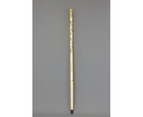 A Japanese 19th century bone walking stick, incised decoration depicting monkeys. 92cm length. Provenance: From private colle