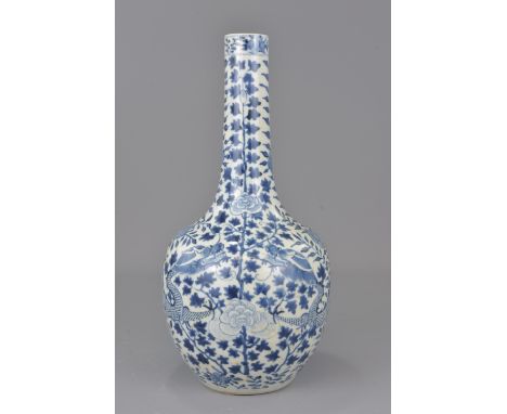 A Chinese 19th century blue and white porcelain bottle vase decorated with dragon with four character mark of Kangxi. 36cm ta