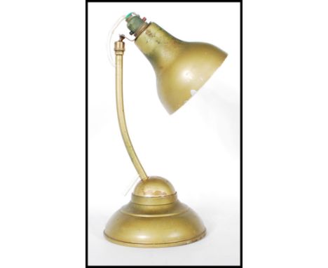 A mid 20th Century 1940's vintage metal industrial ball joint desk table lamp raised on a round stepped base with&nbsp;pendan