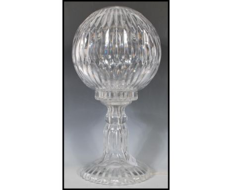 A 20th Century Waterford crystal two part table lamp with slice decoration, comprising a spherical shade, on a bulbous base