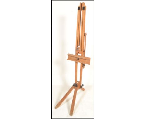 A large 20th Century Winsor &amp; Newton Ltd, London, wooden artists folding easel frame on tripod feet. Applied ivorine make