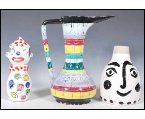 A group of three mid 20th Century ceramic wares to include a decorative San Polo Italian water jug vessel having a black grou
