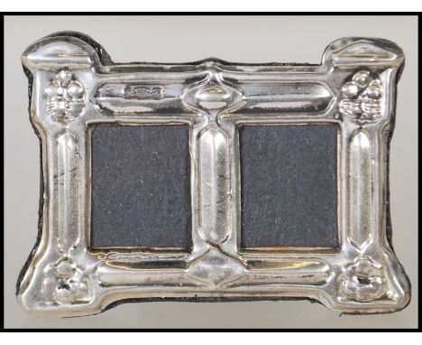 A silver hallmarked Art Nouveau style easel back double photo frame of rectangular form. Hallmarked for Birmingham 925, maker