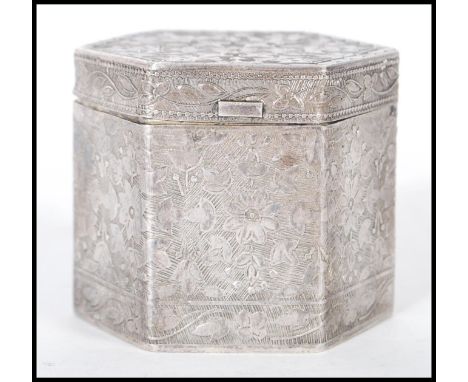 A 20th Century Chinese silver white metal lidded trinket pot of hexagonal form having raised floral patterning, with a hinged