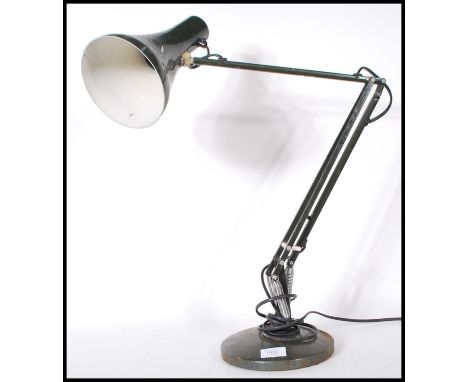A vintage 20th Century Herbert Terry anglepoise desk lamp having a pendant shade on an adjustable metamorphic arm raised on a