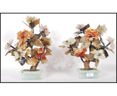 A pair of large Chinese jade and hardstone Ming trees each modelled with peony flowers and raised in jade / jadeite planters.