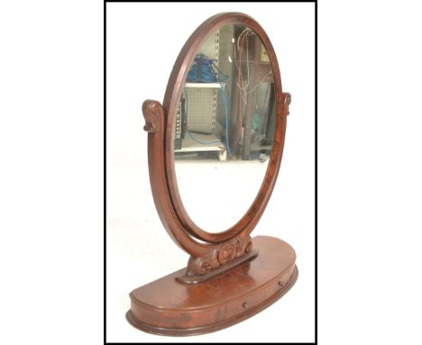 A 19th century large Victorian mahogany oval ladies dressing table vanity mirror with good lozenge shaped plinth base having 