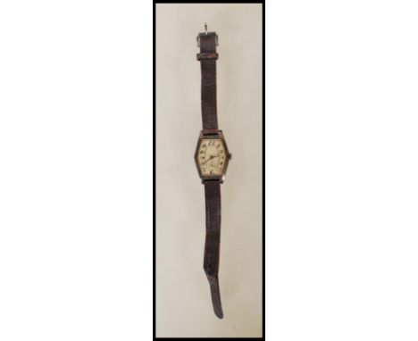 An Art Deco hallmarked silver watch with leather strap having an engine turned face with subsidiary dial. Import marks for Lo