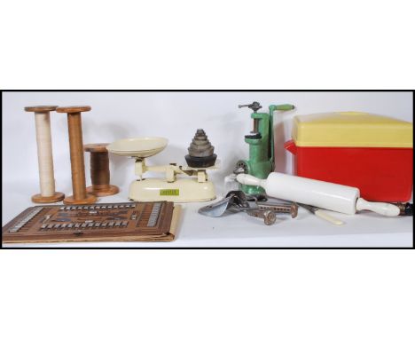 A collection of miscellaneous items dating from the first half of the 20th Century to include an enamel hand mincer by Salter