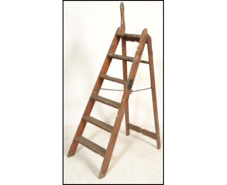 An early 20th Century pine and iron mounted ' Simplex Ladder ', with Self Acting Stop, Patent No. 6958. Measures 165 cm high.