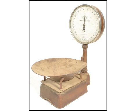 A set of early 20th Century Salter spring balance grocers scales, gilt finish with circular dial stamped Salter Spring Balanc
