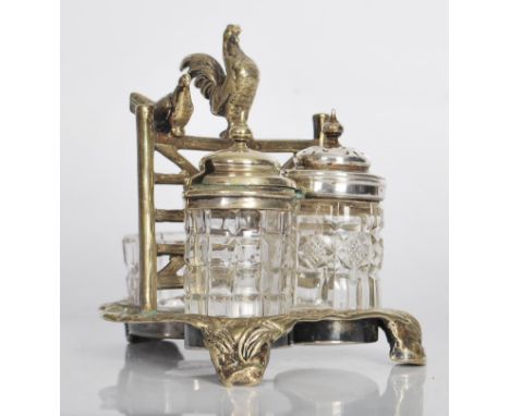 A 19th Century High Victorian silver plated and cut glass three piece table cruet set, the silver plated cruet stand modelled