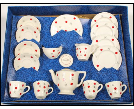 A mid 20th Century child's decorated pottery tea service by Ellar, four cups with saucers, side plates, creamer, sugar bowl a