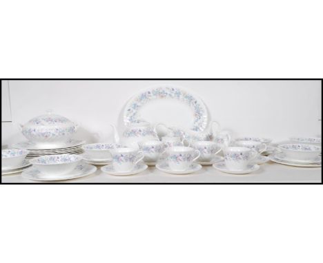 A vintage Wedgwood china tea / dinner service in the Angela pattern to include dinner plates, side plates, bowls, tea pot, cu