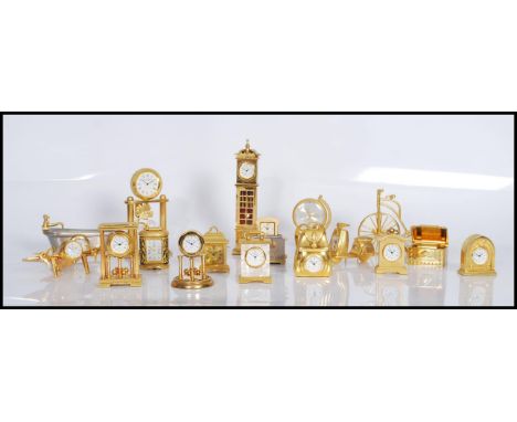 A collection of brass and yellow metal miniature&nbsp;novelty quartz clocks (mostly by William Widdop) to include&nbsp;one in