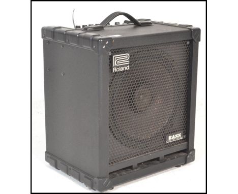 Musical Equipment. A Roland Cube 100 Bass guitar amplifier CB-100&nbsp; bearing serial no 2745726 - ac 230v 50/60 hz 28w. Mea