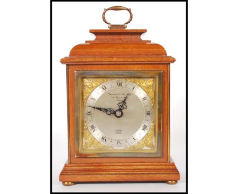 A 20th Century Elliot mantel clock retailed by Garrard &amp; Co Ltd Regent Street London, having a silvered face with roman n