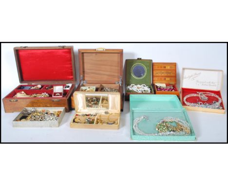 A large collection of 20th century costume jewellery to include enamel and stone set yellow and white metal brooches together