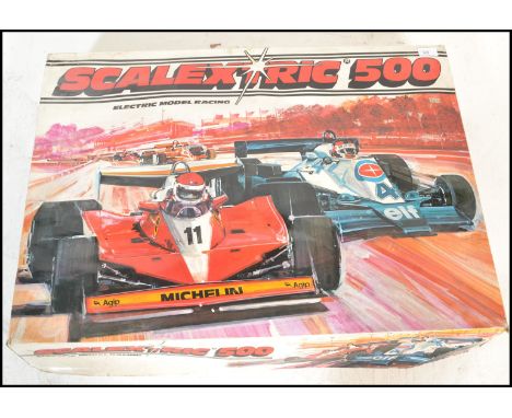 A vintage retro 20th Century Scalextric 500 electronic slot car racing game. Cars included&nbsp;Elf Tyrrell 008 Super Formula