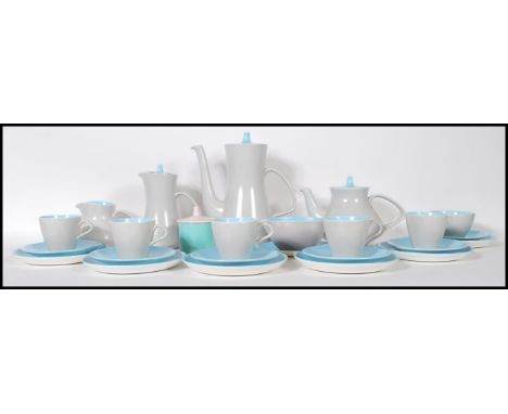 A mid century retro Poole pottery tea service in a blue and mushroom grey colourway. To include plates, and side plates, teac