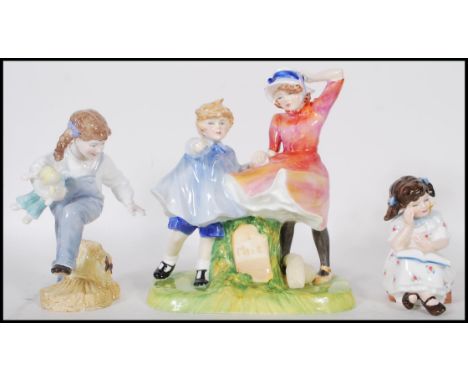 A Royal Doulton figure group entitled 'Milestone' depicting a boy and a girl at a 1 mile marker together with a 'Storytime' (