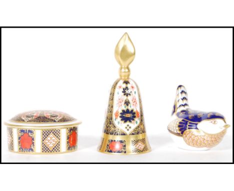 A group of three 20th Century Royal Crown Derby Imari pattern China pieces to include a candle snuffer, lidded trinket pot bo