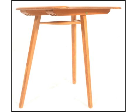 Ercol- A retro mid 20th Century beech and elm blonde Ercol table extension raised on tapering splayed legs. Blue label to ver