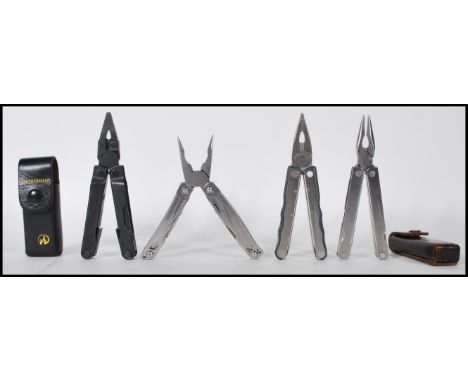 A group of four Leatherman USA pocket tools. Two in original leather case with each one being a different models, the models 