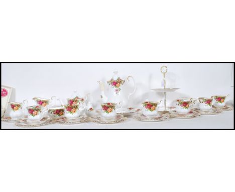 A Royal Albert fine bone china coffee and part tea service in the Old Country Roses pattern. The service consisting of two ti