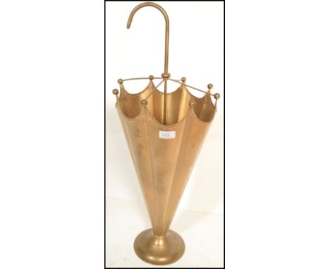 A 20th Century hammered brass antique style umbrella / stick stand in the form of an umbrella having a sectional interior, ra