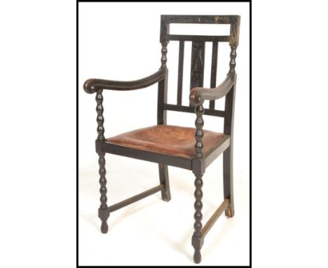 A good 19th Century carved ebonised oak bobbin open framed armchair / desk chair, carved open panel slatted backrest with sha