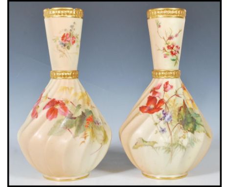 A pair of&nbsp; Royal Worcester blush ivory vases, with conical necks and wrythen body, decorated with spring flowers on an i