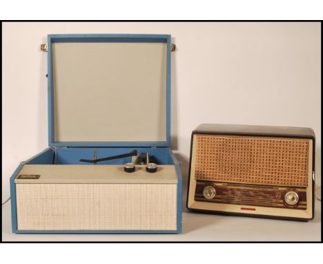 A retro mid century Tellux portable record player in a blue and white colourway together with a 1940's bakelite transistor ra