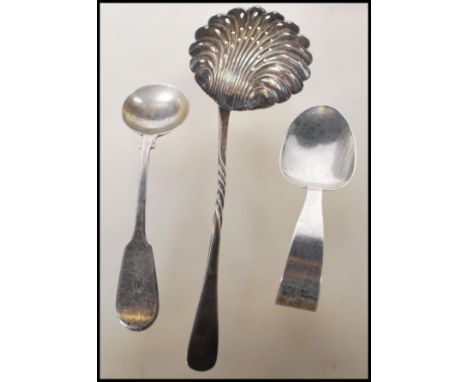 A selection of English hallmarked silver spoons to include a gadrooned caddy spoon (hallmarked Birmingham 1892), an invalid s