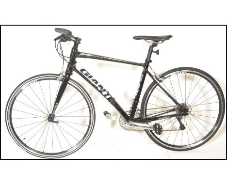 A Giant Aluxx fluidform Rapid Compact Road Design bicycle / bike. LIghtweight hybrid road bike in black and white colourway. 