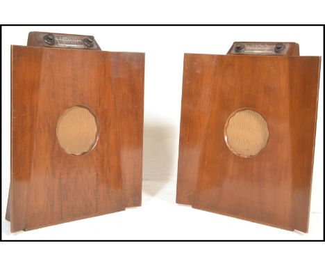 A pair of vintage 20th Century Murphy model 146 batwing floorstanding mains valve radios, the shaped and canted walnut case w
