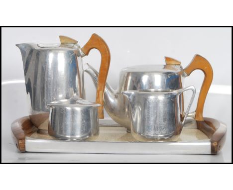 A vintage retro mid 20th Century Picquot Ware coffee/ tea service made from stainless steel and beech wood including a teapot