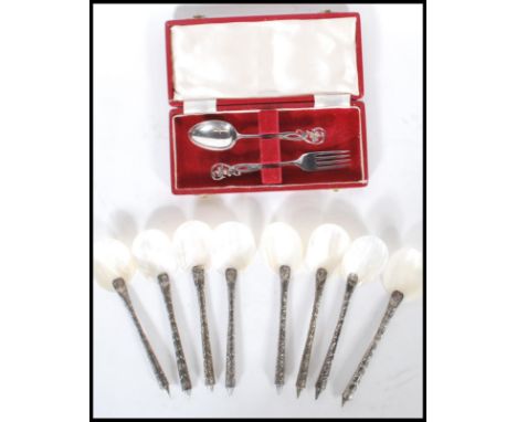 A silver hallmarked foliate pierced spoon and fork dessert cutlery set in original retailers box, Sheffield assay and dating 