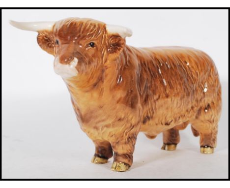 A Beswick ceramic figurine of a Highland cattle bull being stamped for Beswick, England to the foot.&nbsp;