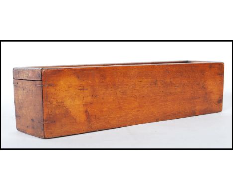 A set of 19th Century Victorian ebony and bone dominoes set within a mahogany box with a sliding lid, including 55 dominoes. 