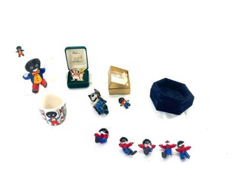 Selection of vintage Robertsons items to include an early figure, badge, miniatures etc Notice from the the-saleroom.com: The