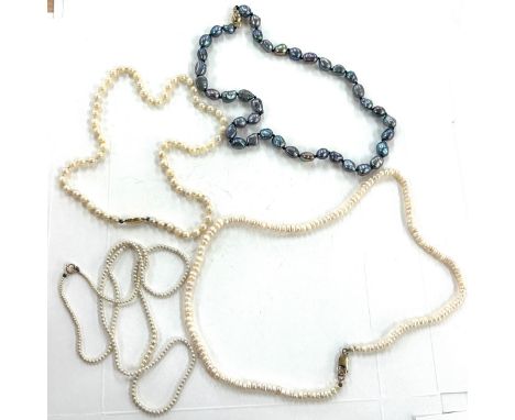 Tahitian pearl bead necklace clasp stamped 14 k and three other pearl neck laces with 9 ct gold clasps 