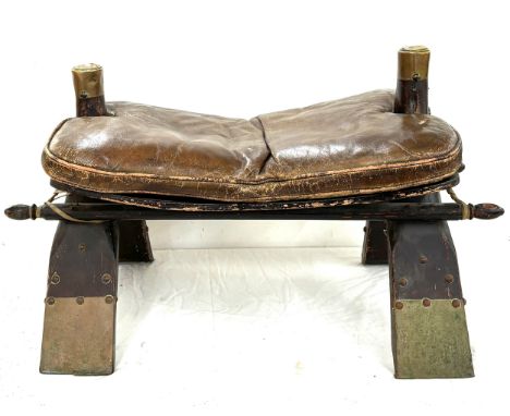 Vintage camel saddle measures approximately 15inches by 26 inches by 16 inches 