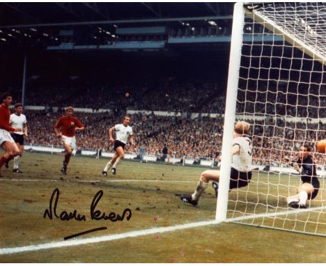 Martin Peters signed 10x8 inch colour photo pictured scoring his goal for England during the 1966 world cup final. Good condi