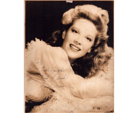 Dinah Shore signed 10x8 inch vintage sepia photo affixed to card. Dedicated. Good condition. All autographs come with a Certi